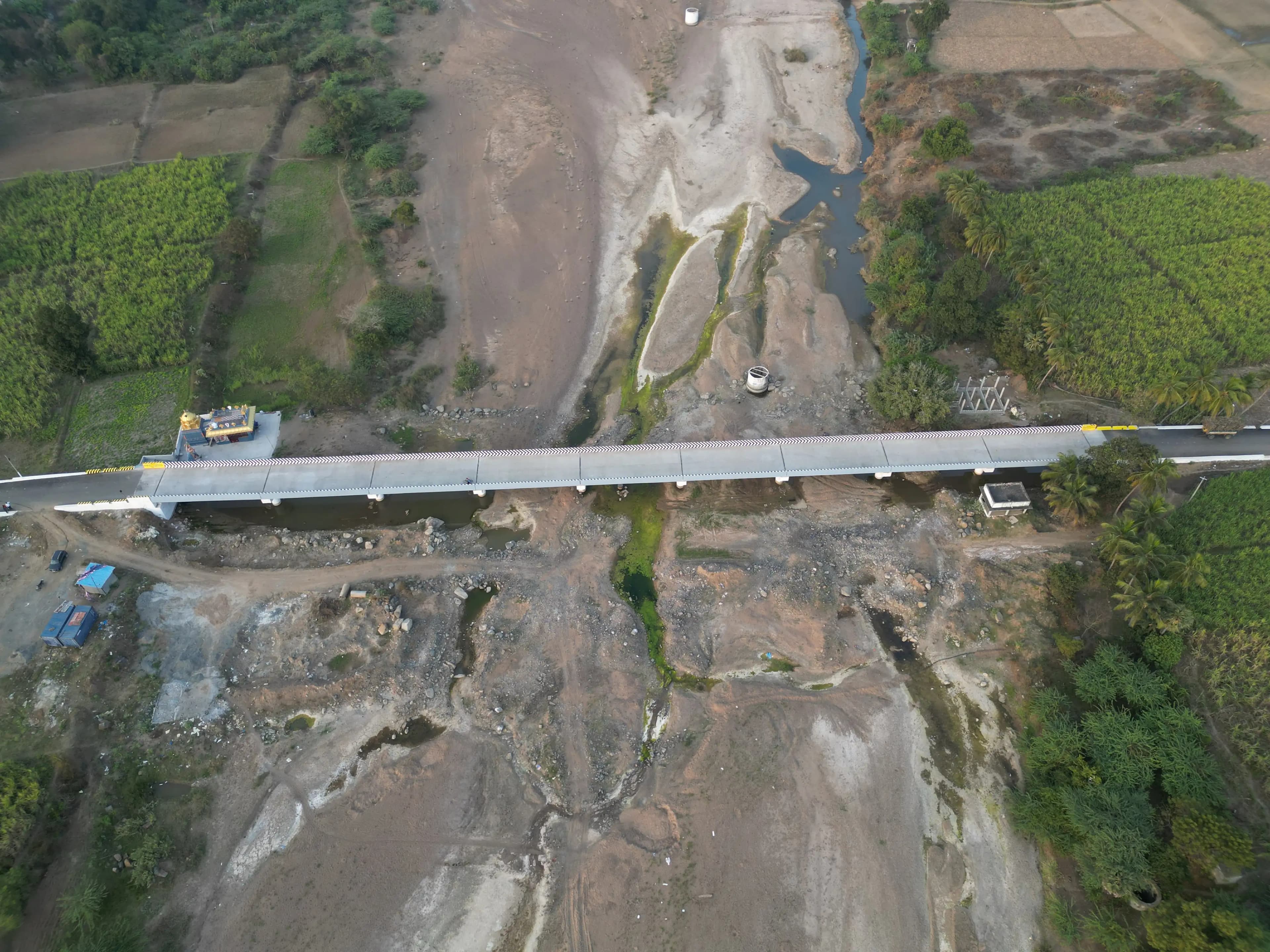 Aerial project view showing bridge, water channel, and surrounding works